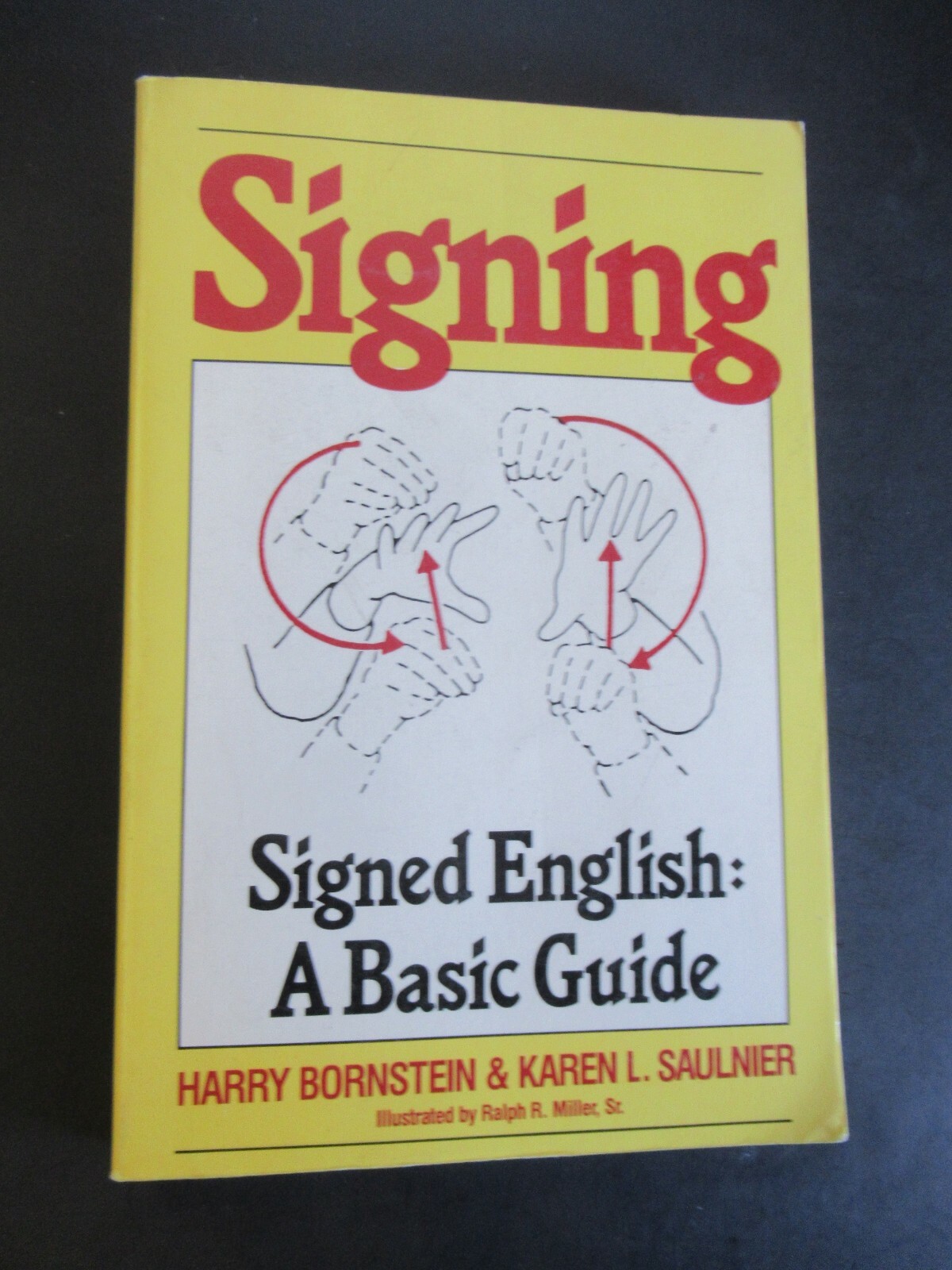 SIGNING-ENGLISH: A BASIC GUIDE BY HARRY BORNSTEIN & KAREN SAULNIER 1988a