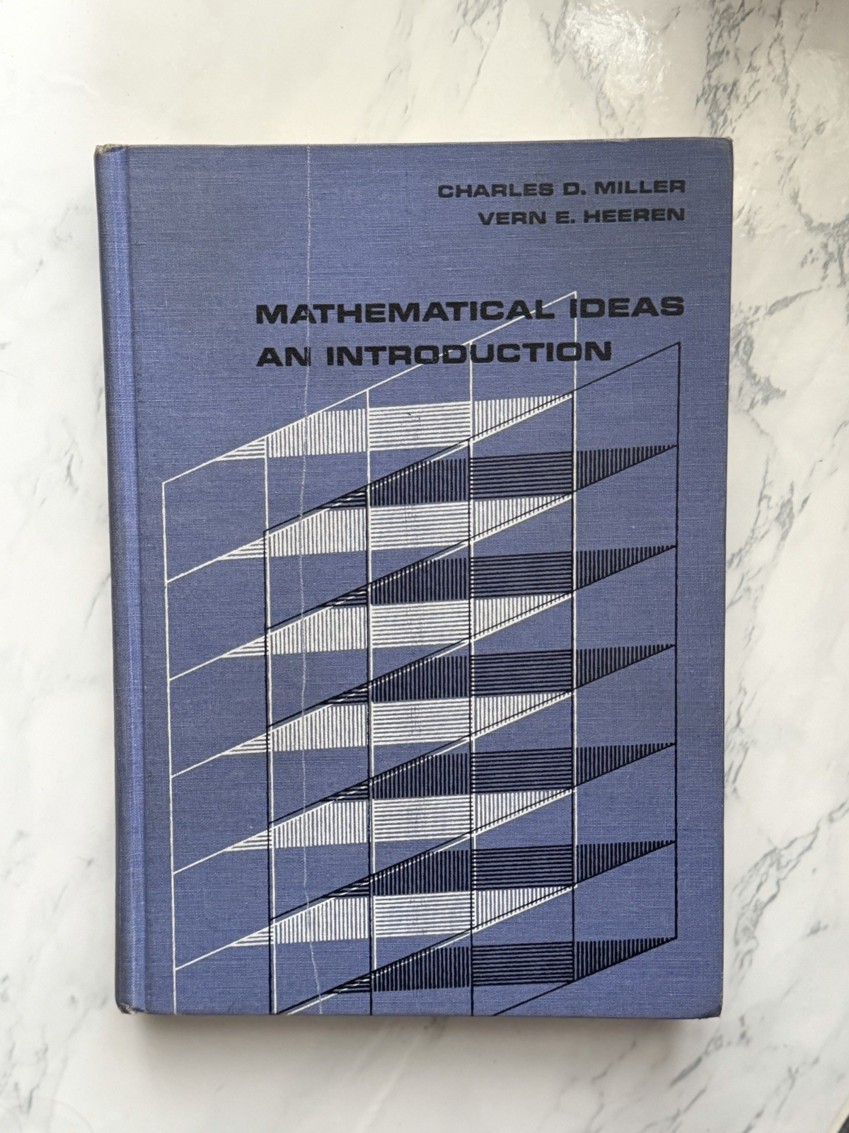 Mathematical Ideas: An Introduction by Vern E. Heeren and Charles Miller (1969)