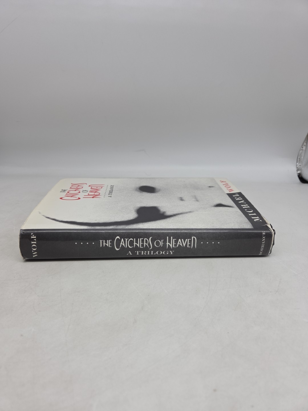 The Catchers of Heaven: Trilogy – (Michael Wolf, HCDJ, 1996, Second Printing)
